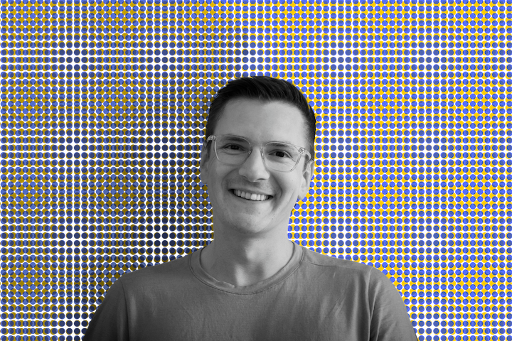 Black and white portrait photo of pavel reissmann on dotted backround